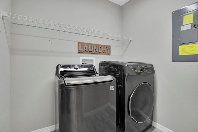 laundry area featuring washer and clothes dryer and electric panel