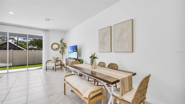 dining space with light tile patterned floors