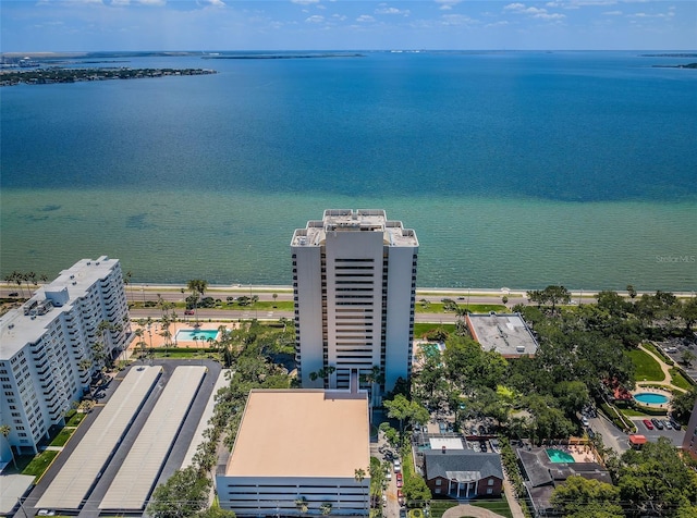 birds eye view of property with a water view