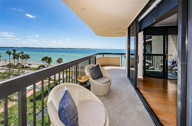 balcony featuring a water view