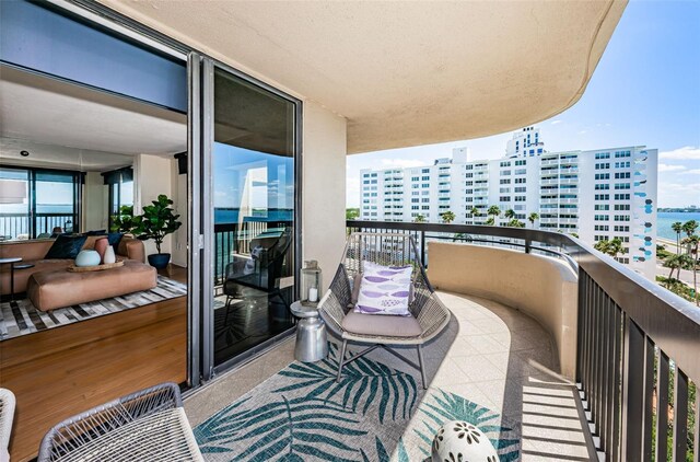 balcony featuring a water view