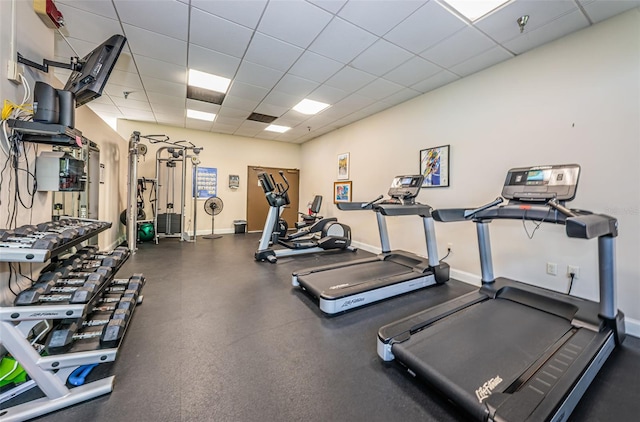 exercise room with a drop ceiling