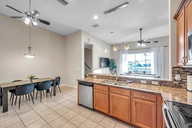 kitchen with ceiling fan, sink, hanging light fixtures, stainless steel dishwasher, and light tile patterned floors