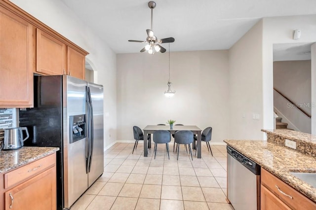 kitchen with ceiling fan, decorative backsplash, light tile patterned floors, appliances with stainless steel finishes, and light stone counters