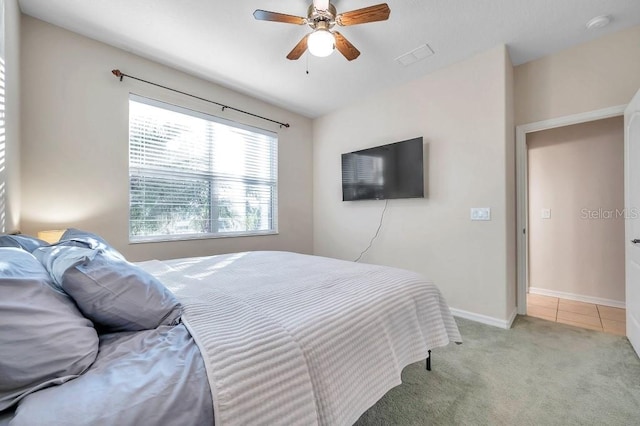 carpeted bedroom featuring ceiling fan