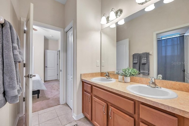 bathroom with tile patterned flooring and vanity