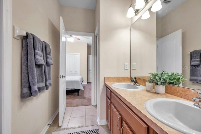 bathroom featuring tile patterned floors, vanity, and ceiling fan