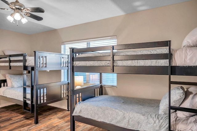 bedroom featuring ceiling fan and wood-type flooring