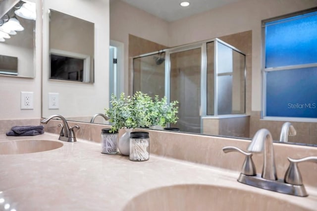 bathroom with vanity and walk in shower