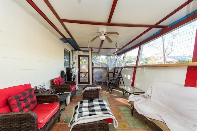 sunroom / solarium featuring ceiling fan