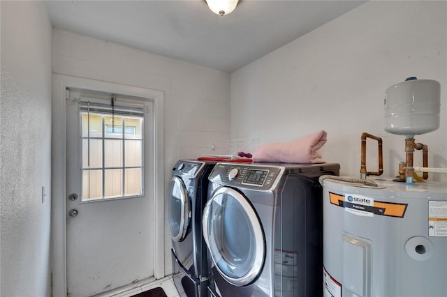 washroom featuring independent washer and dryer and electric water heater