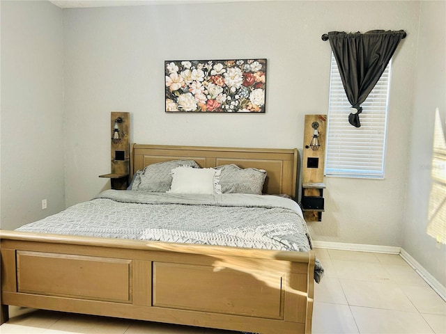 bedroom featuring light tile patterned flooring