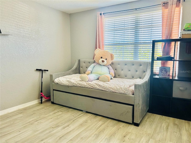 bedroom with light wood-type flooring