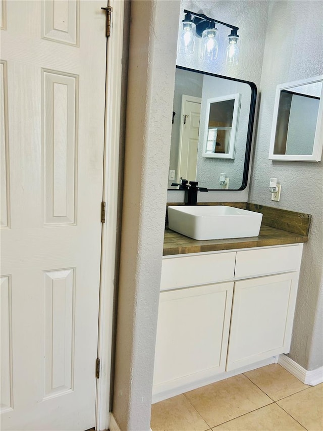 bathroom with vanity and tile patterned floors