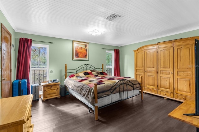 bedroom featuring dark hardwood / wood-style floors and crown molding