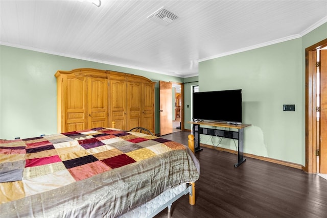 bedroom featuring crown molding, dark wood-type flooring, and a closet