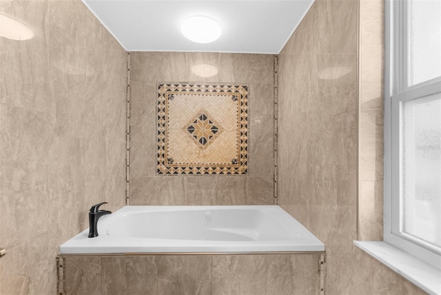 bathroom with tile walls and tiled tub