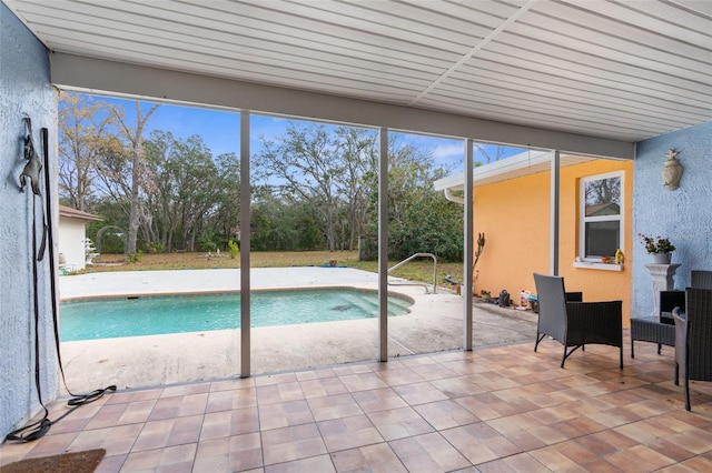 view of pool featuring a patio area