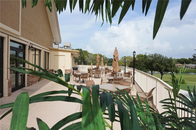 view of patio with a water view