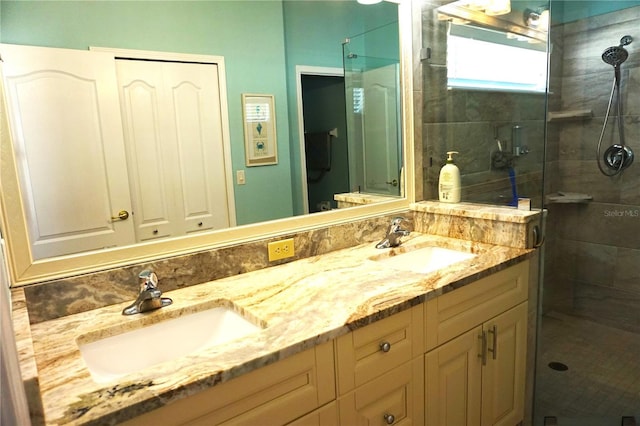 bathroom featuring vanity and a shower with shower door