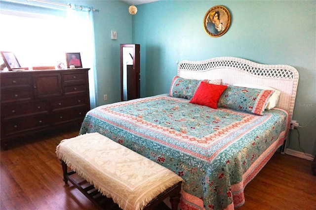 bedroom featuring dark wood-type flooring