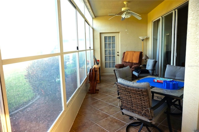 sunroom with ceiling fan and a healthy amount of sunlight