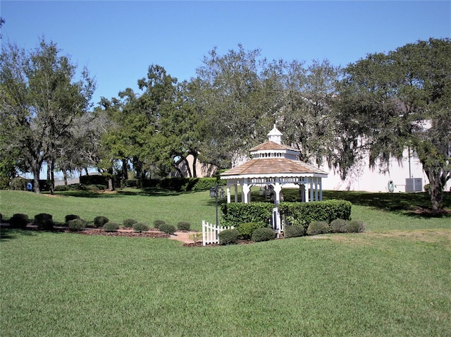 surrounding community featuring a gazebo and a yard