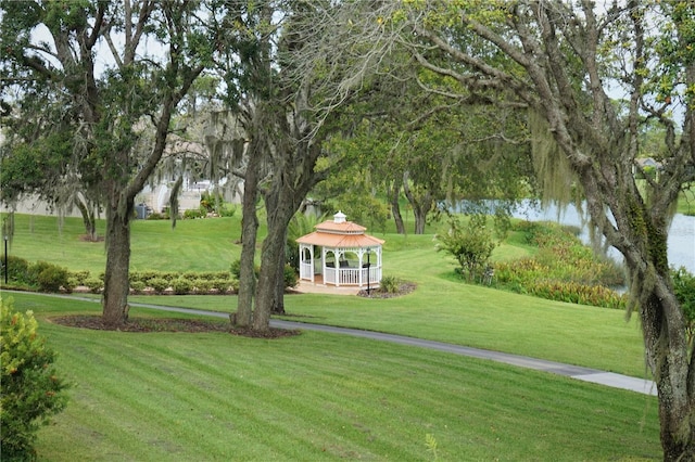 11021 Edge Park Dr, Hudson, FL 34667 - surrounding community featuring a gazebo, a lawn, and a water view