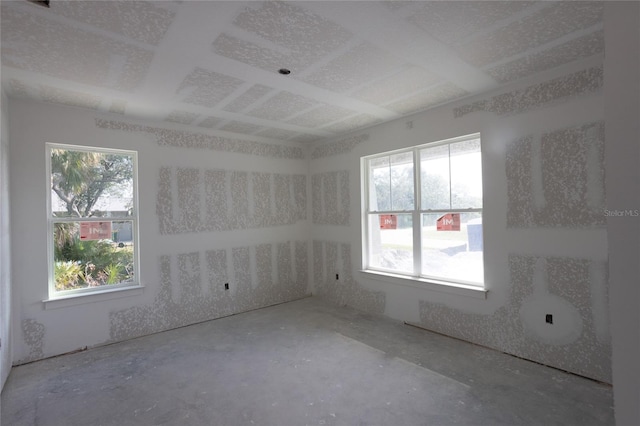 unfurnished room featuring concrete flooring