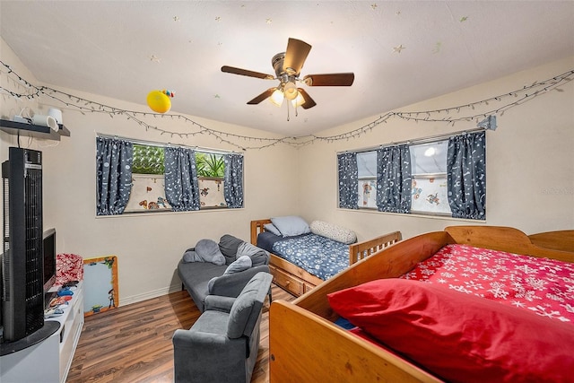 bedroom with wood-type flooring and ceiling fan