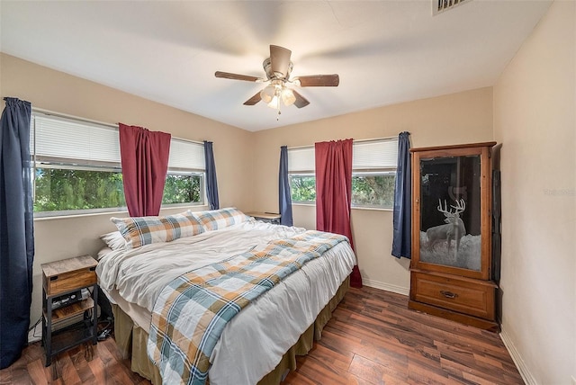 bedroom featuring dark hardwood / wood-style flooring and ceiling fan