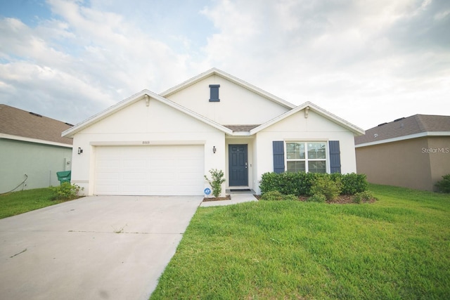 single story home featuring a garage and a front yard