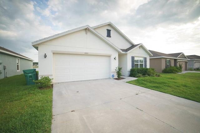 ranch-style house with a front lawn and a garage