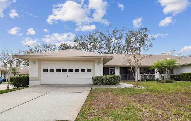 single story home with a front yard and a garage