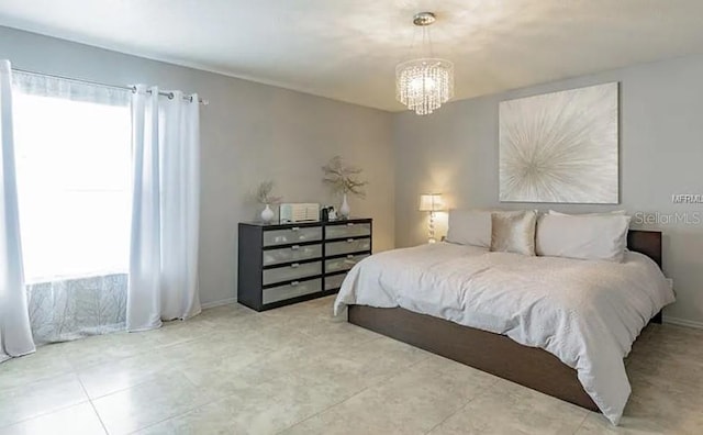 bedroom featuring an inviting chandelier