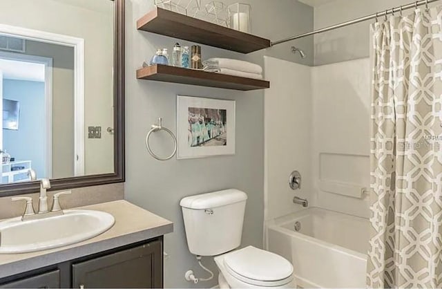 full bathroom featuring vanity, toilet, and shower / tub combo