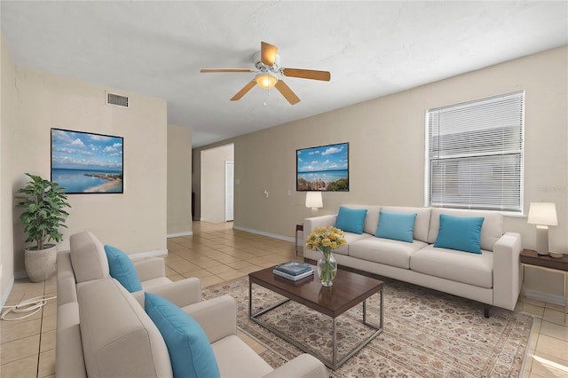 tiled living room featuring ceiling fan