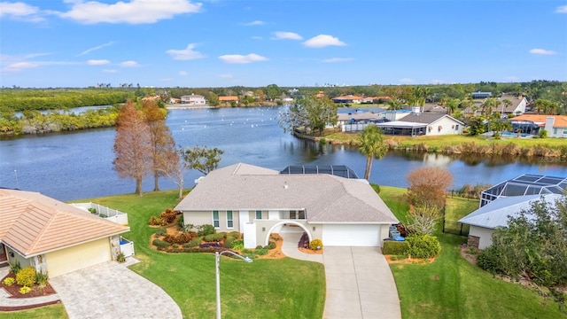 birds eye view of property with a water view and a residential view