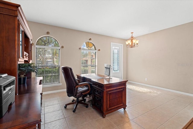 office area featuring an inviting chandelier and light tile patterned flooring