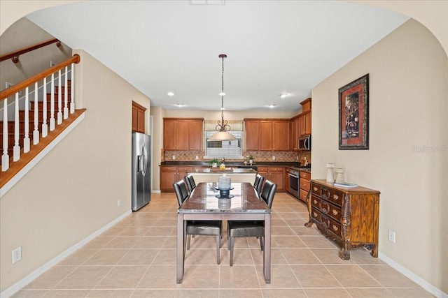 dining area with light tile patterned floors