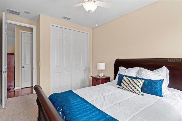 carpeted bedroom featuring a closet and ceiling fan