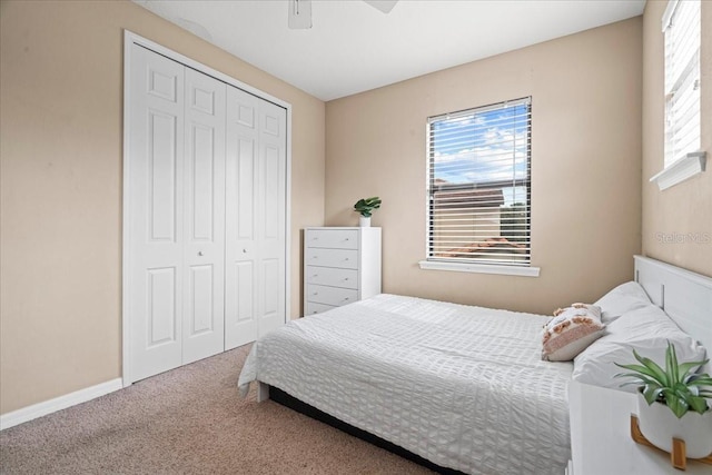 bedroom with carpet flooring, a closet, and ceiling fan