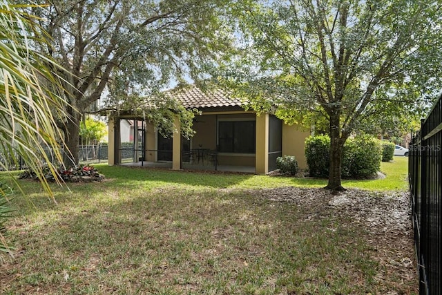 view of yard with a sunroom