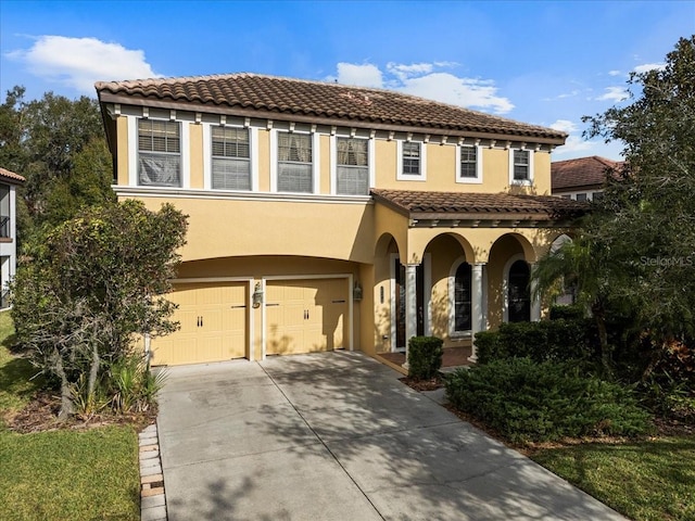 mediterranean / spanish house featuring a garage