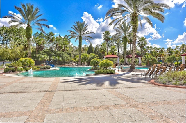 view of swimming pool featuring pool water feature