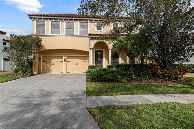 mediterranean / spanish-style home featuring a garage