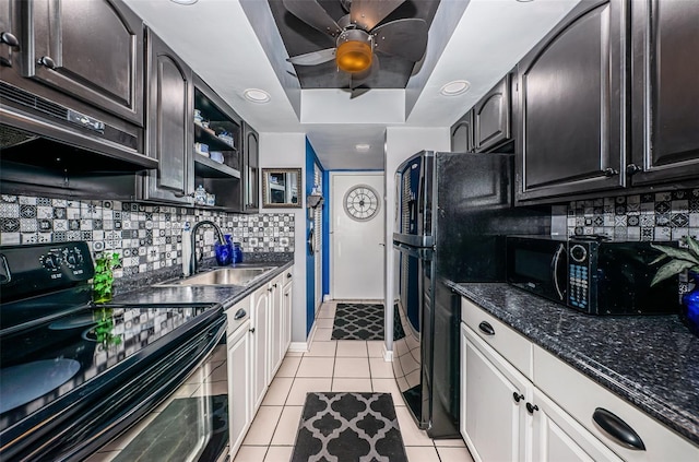 kitchen featuring white cabinetry, sink, ceiling fan, light tile patterned floors, and black appliances