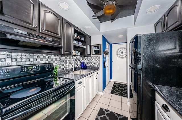 kitchen with backsplash, black appliances, white cabinets, sink, and light tile patterned floors