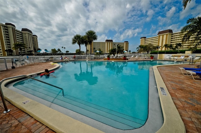 view of swimming pool featuring a patio area