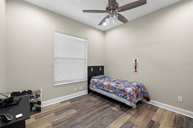 bedroom with ceiling fan and hardwood / wood-style flooring